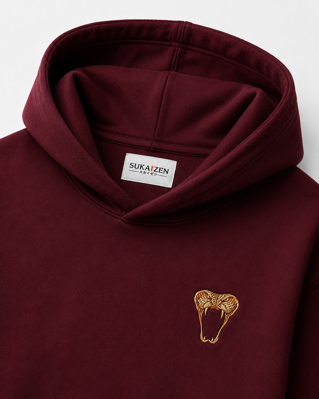 Emerald Serpent Coil Hoodie by Sukaizen in burgundy red with snake fang chest embroidery and large serpent back design
