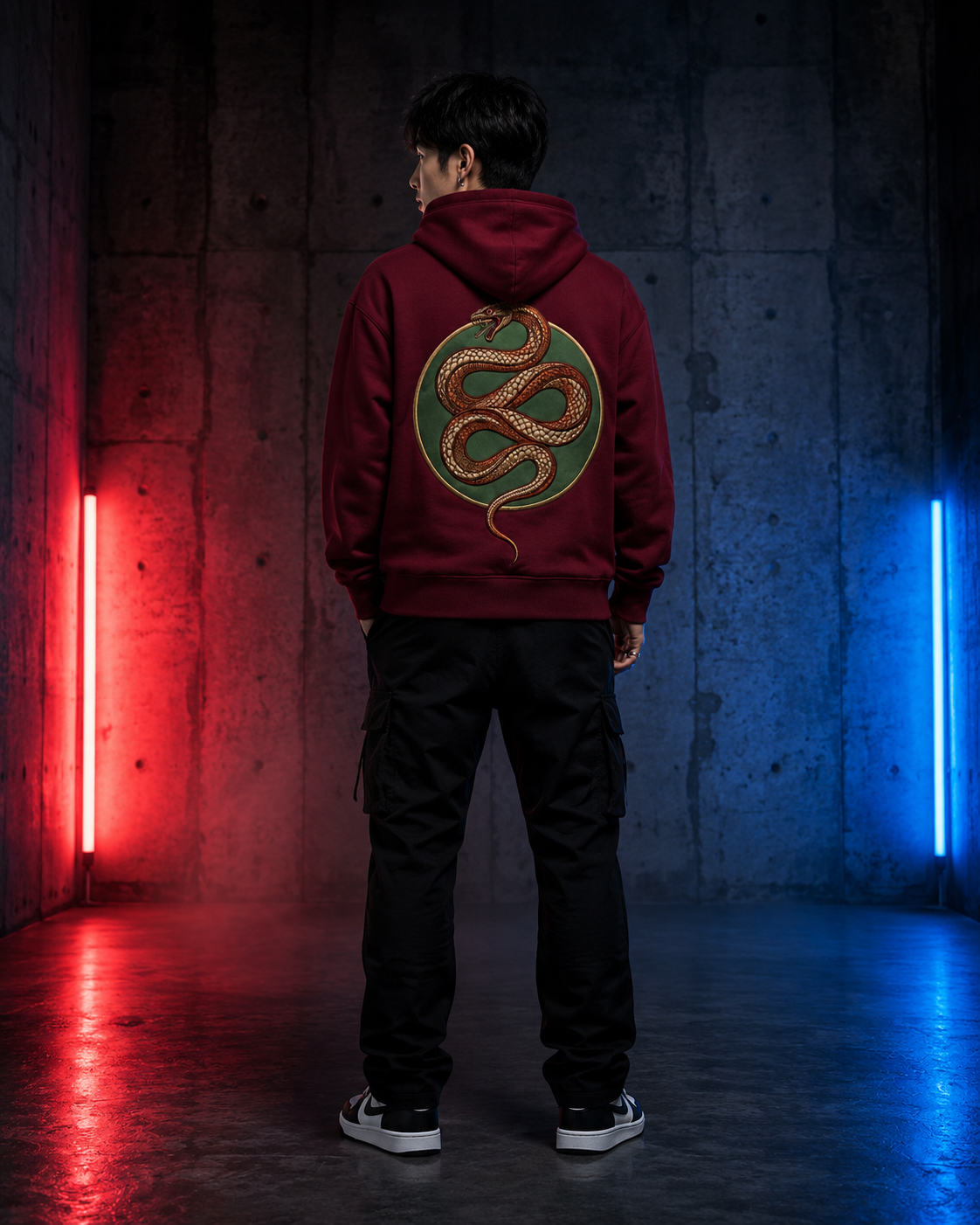 Emerald Serpent Coil Hoodie by Sukaizen in burgundy red with snake fang chest embroidery and large serpent back design