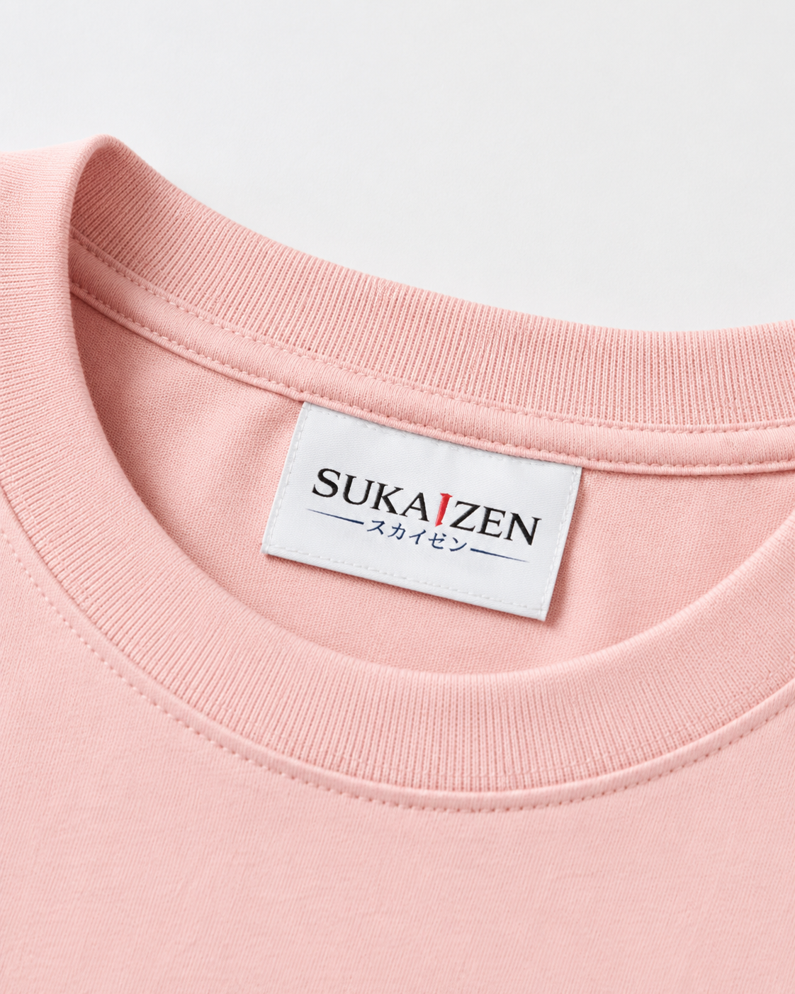 Sakura Koi Wave T-Shirt by Sukaizen in soft pink with red koi fish wave and sakura blossom embroidery