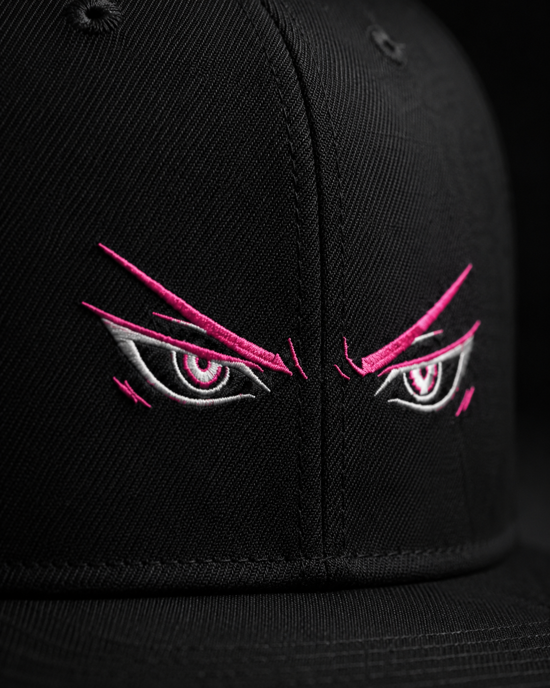Shadow Anime Eyes Embroidered Cap in black with pink and white anime eye embroidery and flat brim