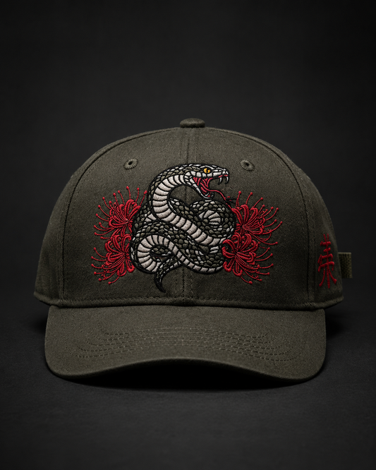 Serpent Bloom Embroidered Cap in charcoal grey with coiled serpent and red spider lily embroidery